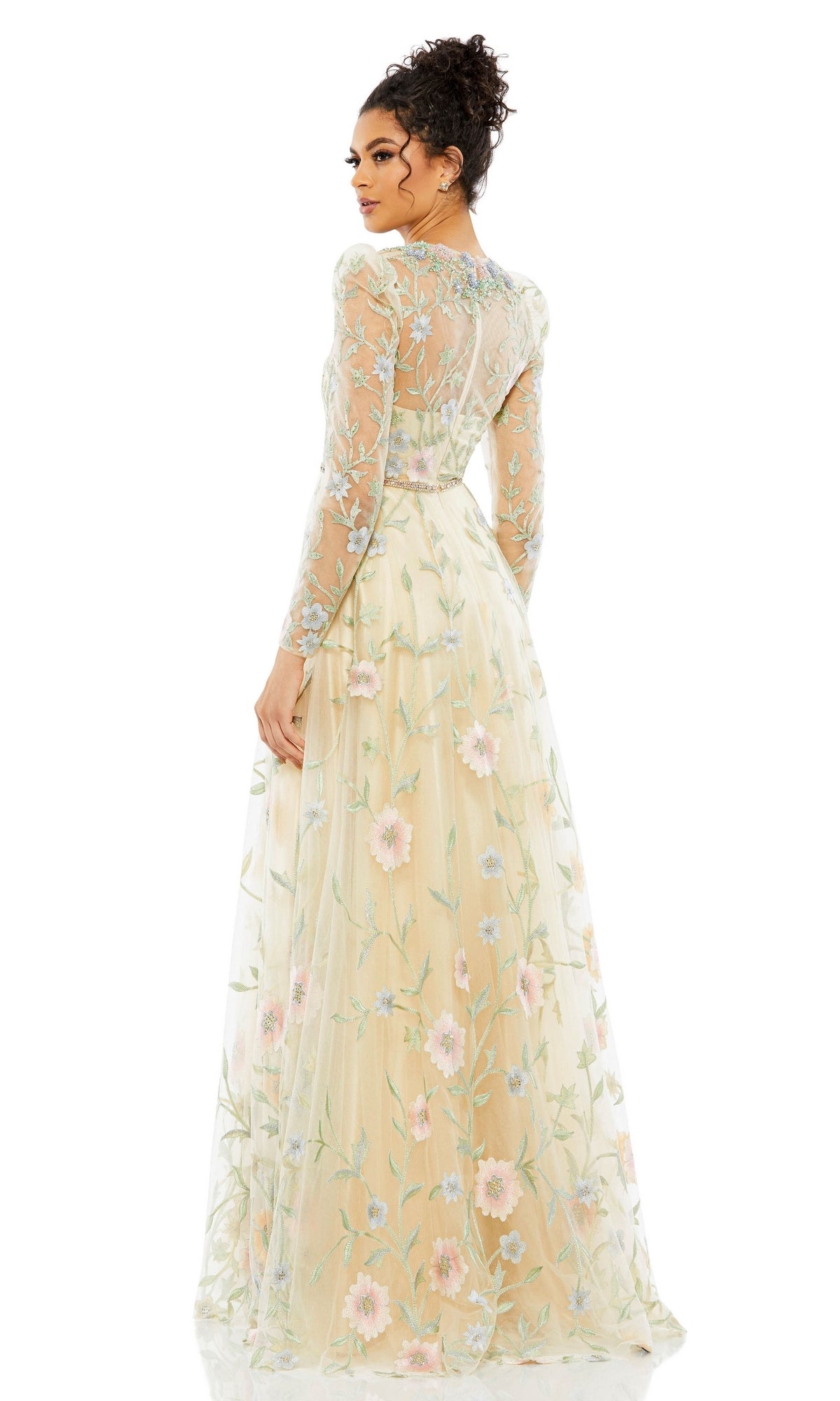 A woman is seen from the back wearing the Long Formal Dress 11226 by Mac Duggal, an A-line gown with long sleeves, sheer fabric, pastel floral embroidery, and a fitted bodice.
